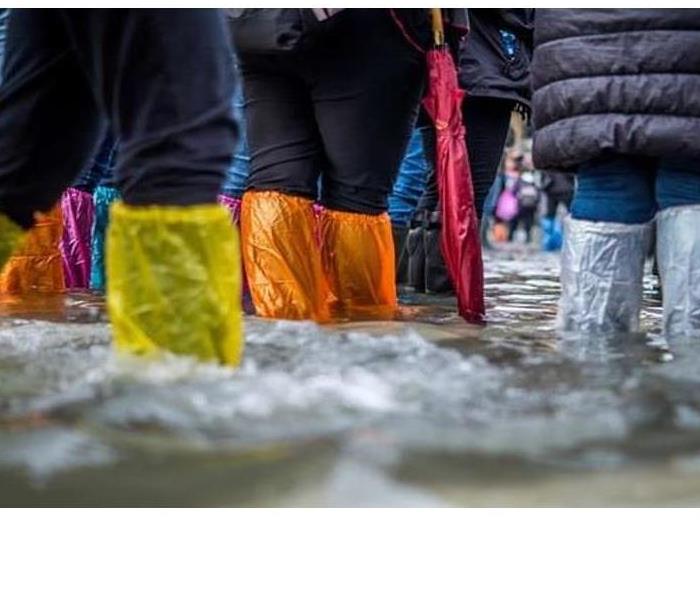 People Walking in a Flood