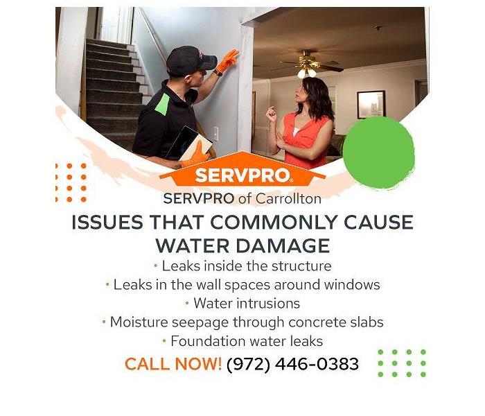 SERVPRO technician examining water damage with a client
